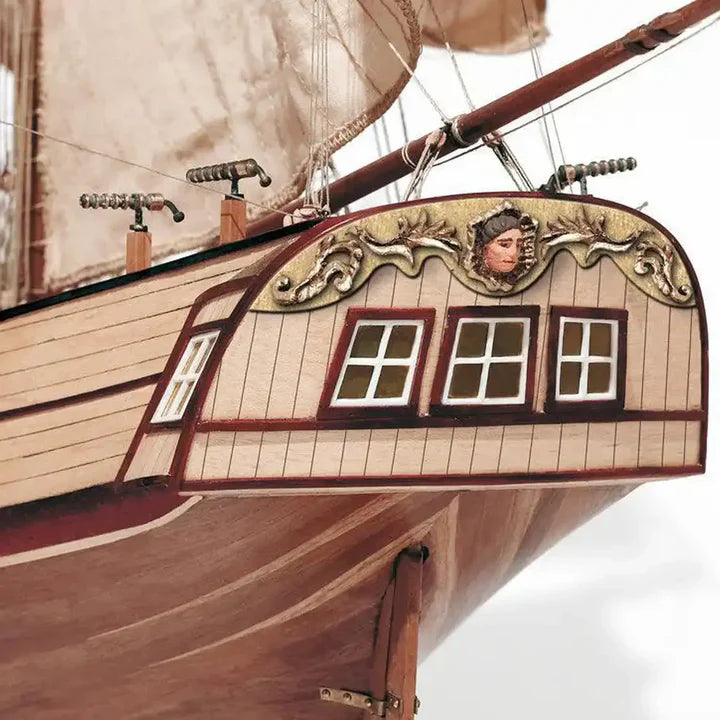 Ornate stern and wooden hull details of OcCre Corsair model ship