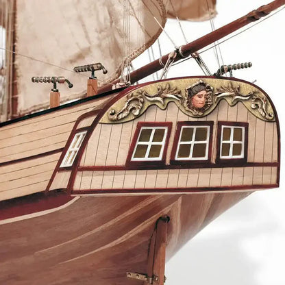 Ornate stern and wooden hull details of OcCre Corsair model ship