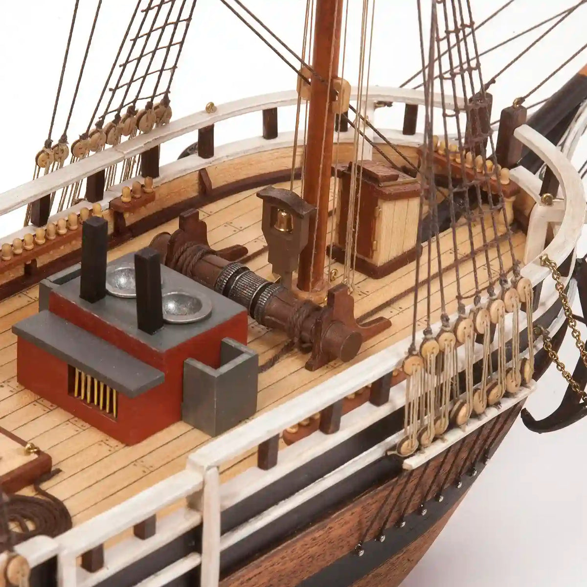 Close-up of the OcCre Essex 12006 wooden whaleship model showing the working deck, wooden structures, railings and historic whaling equipment.