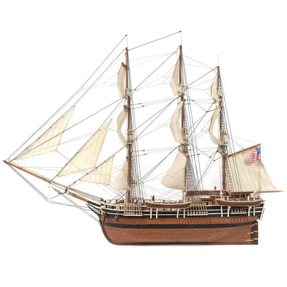 OcCre Essex 12006 wooden whaling ship model kit, 1:60 scale, showing the completed historic Nantucket whaleship with wooden hull, masts, sails and rigging.