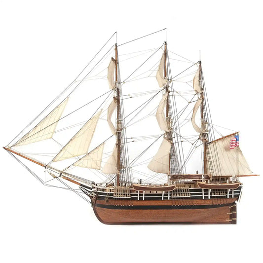 OcCre Essex 12006 wooden whaling ship model kit, 1:60 scale, showing the completed historic Nantucket whaleship with wooden hull, masts, sails and rigging.