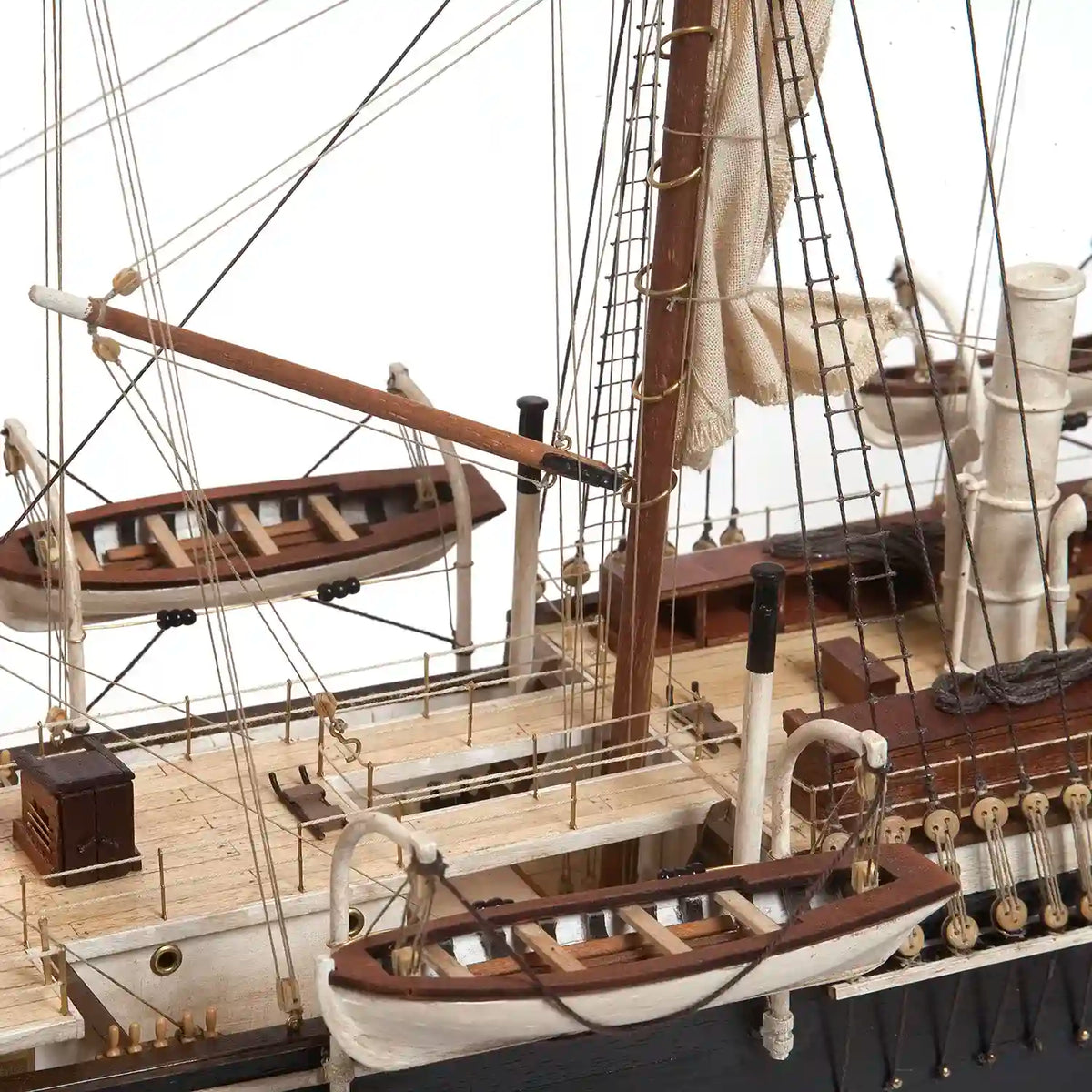 Close-up of the OcCre HMS Endurance 12008 wooden ship model showing deck structures, mast fittings, lifeboats, and intricate rigging details.
