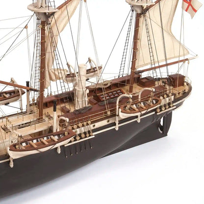 Detailed side view of the OcCre HMS Endurance 1:70 wooden ship model highlighting the black hull, wooden deck, lifeboats, railings, and rigging.