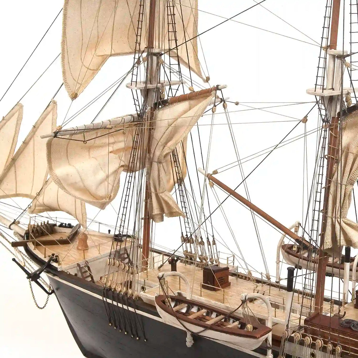 Close-up of the completed OcCre HMS Endurance wooden model ship showing the stern section, deck fittings, lifeboats, masts, and rigging.